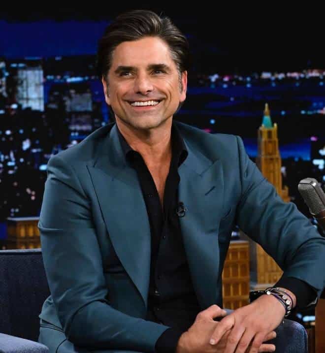 John Stamos giving interview