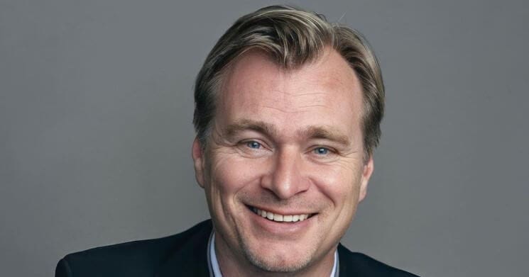 Christopher Nolan smiling on screen