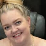 Colleen Hoover signing books for fans