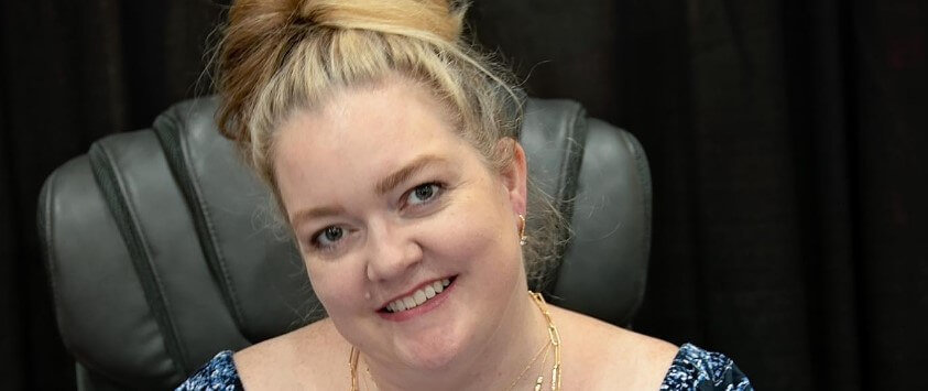 Colleen Hoover signing books for fans