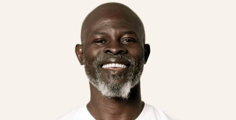 Djimon Hounsou smiling for cover photo