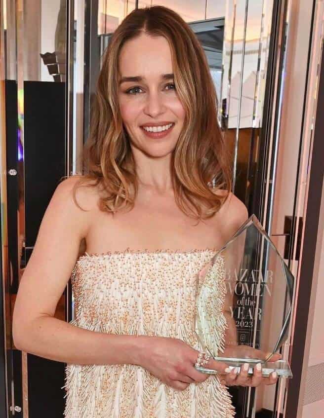 Emilia Clarke holding Bazaar UK Award