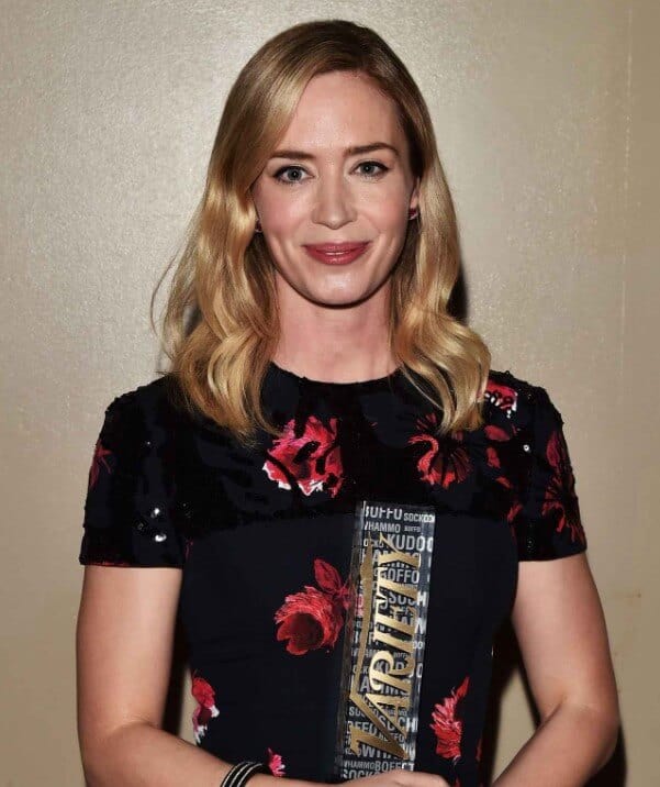 Emily Blunt holding variety award