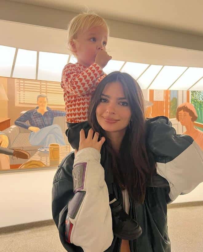 Emily Ratajkowski holding a baby girl