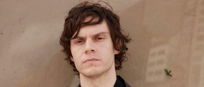 Evan Peters looking into camera