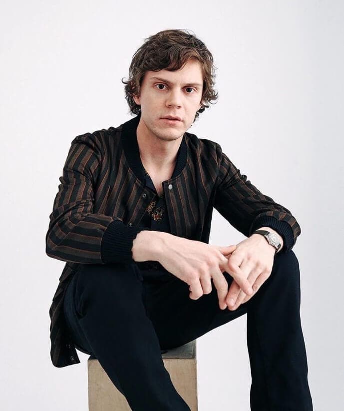 Evan Peters sitting alone for photoshoot