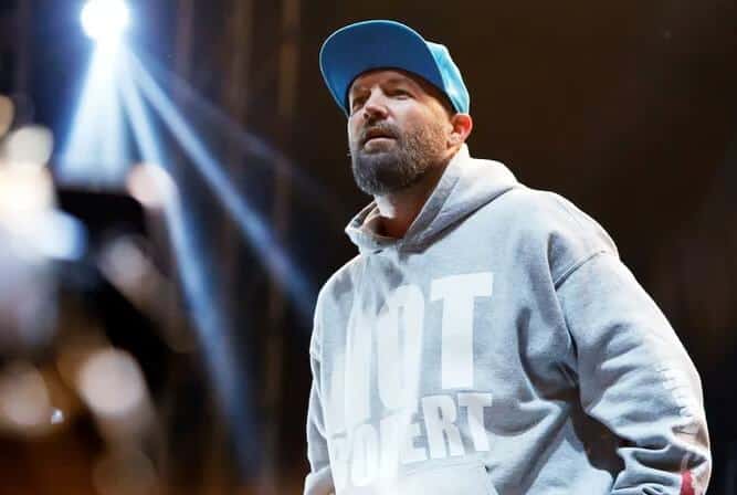 Fred Durst wearing hoodie and cap