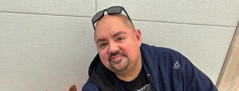 Gabriel Iglesias sitting alone with his dog