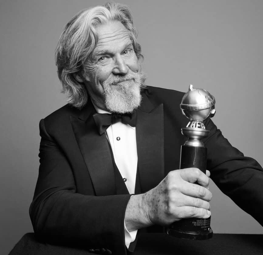 Jeff Bridges holding Golden Globes Awards