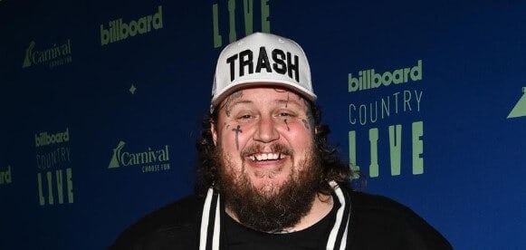Jelly Roll holding Billboard Board