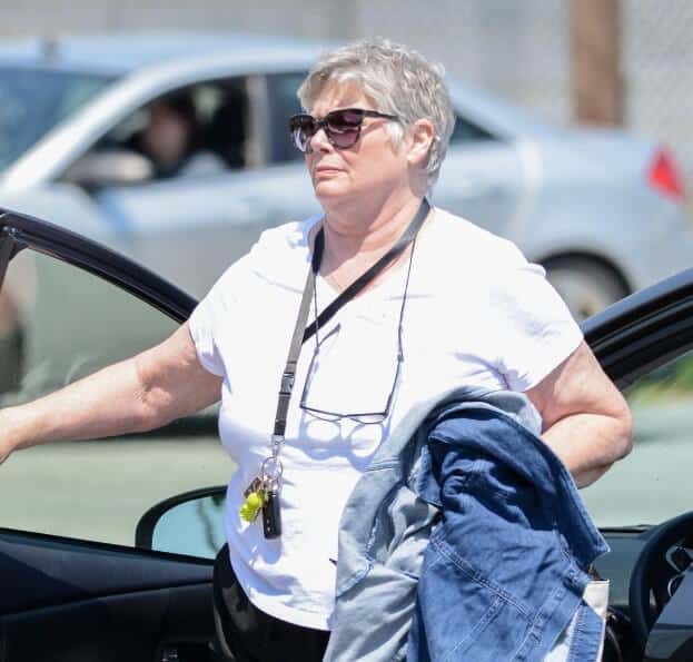 Kelly McGillis walking out from car