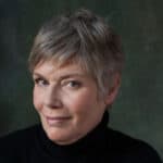 Kelly McGillis wearing all black outfit