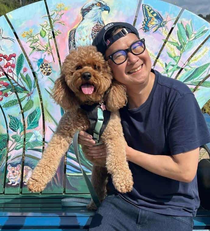 Ken Jeong holding Mocha the Dog