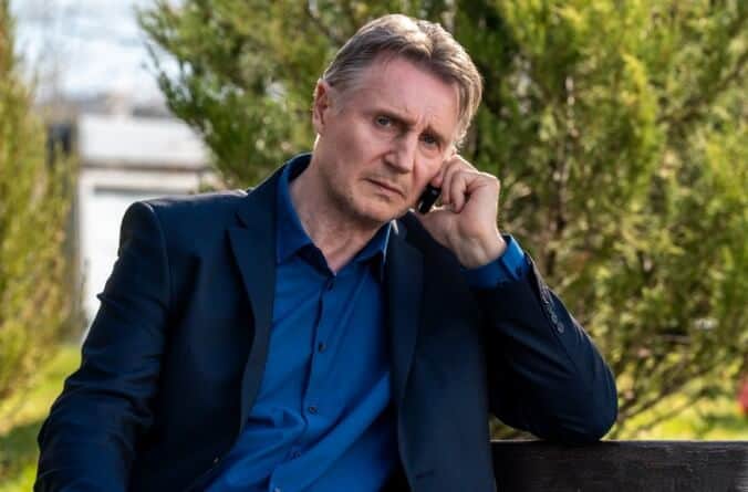 Liam Neeson talking on phone