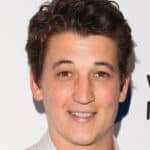 Miles Teller smiling on camera