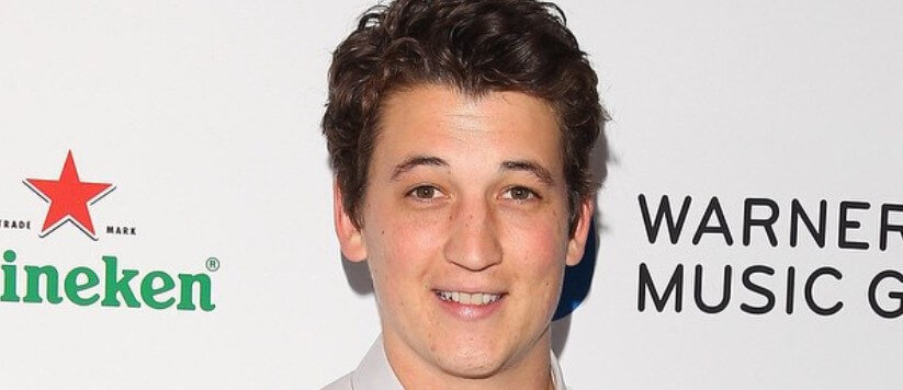 Miles Teller smiling on camera