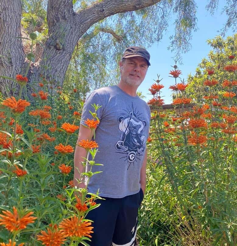 Rainn Wilson in flowers garden