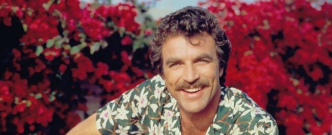Tom Selleck in red ferrari