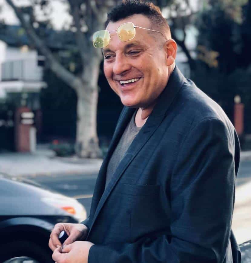 Tom Sizemore laughing on street