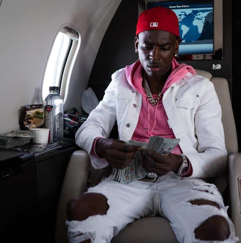 Young Dolph traveling in private jet counting money stacks